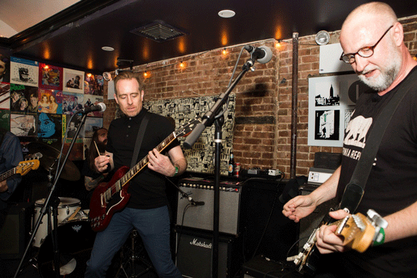 Indie rock musicians Bob Mould, right, and Ted Leo performing at Mike Stuto’s 20-year anniversary party in May 2014.   Photo by Kyle Dean Reinford