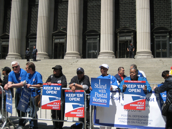 Postal Workers Put Their Stamp on ‘Action’ 1 At the May 14 rally, many construction workers assigned to renovate the Farley post office signed a postcard expressing their solidarity with the New York Metro Area Postal Union. Photo by Dusica Sue Malesevic.