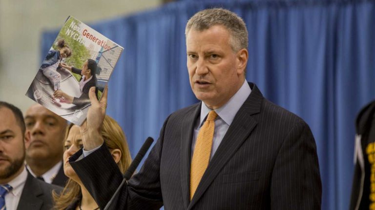 Mayor Bill de Blasio, along with NYHC Chair Shola Olatoye and City speaker Melissa Mark-Viverito, unveils a public housing plan on May 19, 2015, at James Weldon Johnson Community Center in Manhattan.