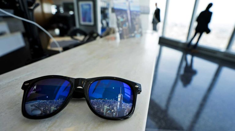 A pair of sunglasses that will be available to visitors rests on a counter at the One Word Observatory at One World Trade Center Wed., May 20, 2015. The observatory opens officially May 29.