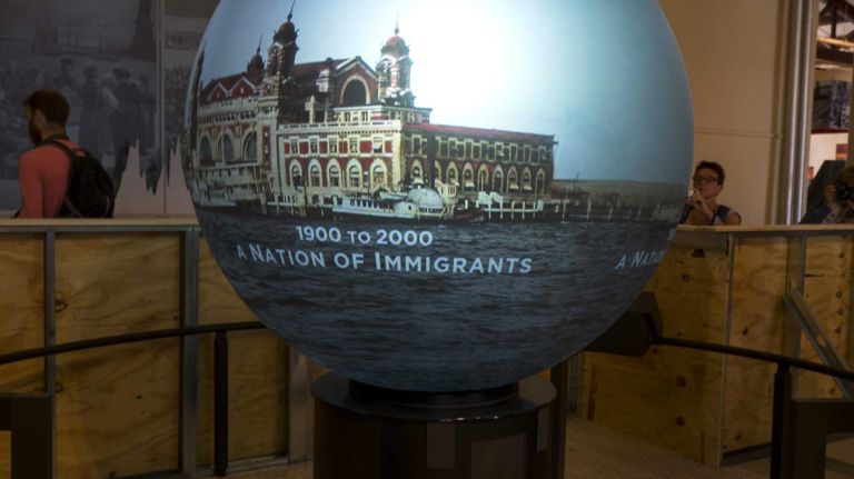 A globe that displays images of global migration of the past and present is previewed May 7, 2015, on Ellis Island, part of The Peopling of America Center that will open May 20th. 