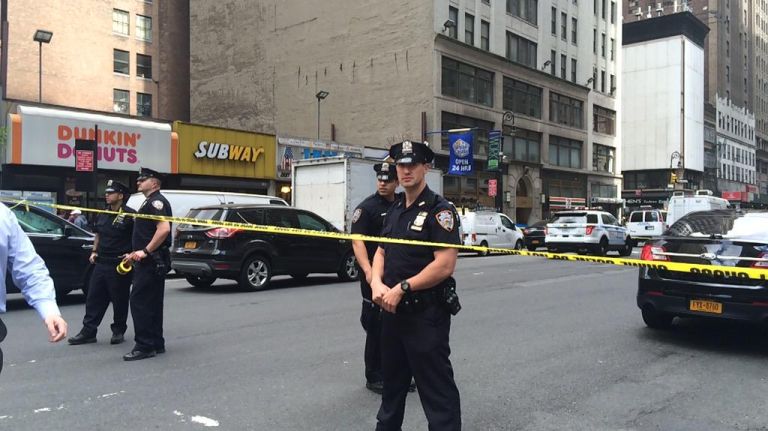NYPD at the scene of shooting at Eighth Ave. and 37th Street. 