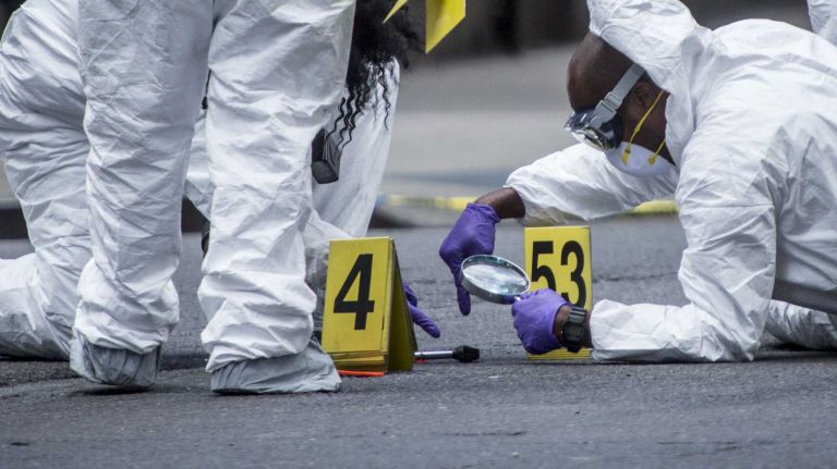 Hammer-attack suspect shot by police in midtown 2 Crime scene investigators at the scene where an officer shot a suspect in a series of hammer attacks at West 37th Street and 8th Avenue in midtown Manhattan on May 13, 2015.