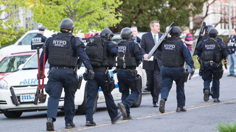 An NYPD officer was shot and wounded in Queens Village on Saturday evening, May 2, 2015, setting off an intense search for the suspect, police said.