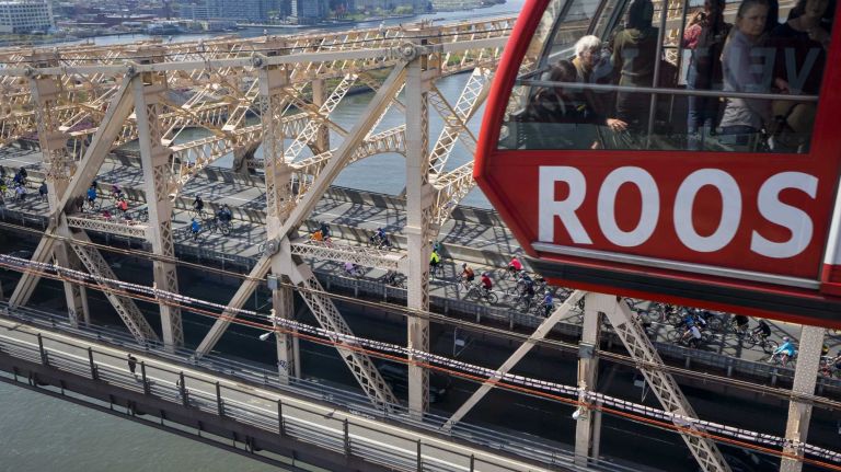 Viewed from the Roosevelt Island Tram, participants move across the Ed Koch Queensboro Bridge as they take part in the Five Boro Bike Tour Sunday, May 3, 2015.