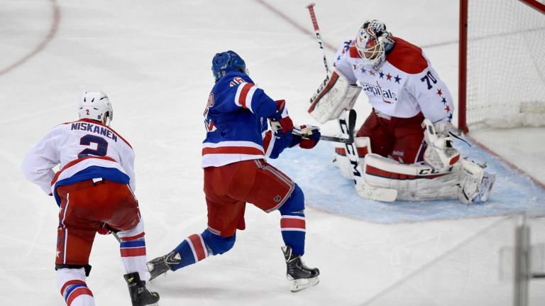 Rangers vs. Capitals: Game 2 of round 2 of Stanley Cup playoffs 25 The New York Rangers' Derick Brassard scores the winning goal against the Washington Capitals' Braden Holtby during the third period of Game 2 of the Eastern Conference semifinals at Madison Square Garden on Saturday, May 2, 2015.