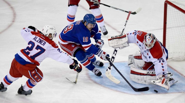 Rangers vs. Capitals: Game 2 of round 2 of Stanley Cup playoffs 26 The New York Rangers' Jesper Fast tries to put the puck past the Washington Capitals' Braden Holtby and the Washington Capitals' Karl Alzner during the third period of Game 2 of the Eastern Conference semifinals at Madison Square Garden on Saturday, May 2, 2015.