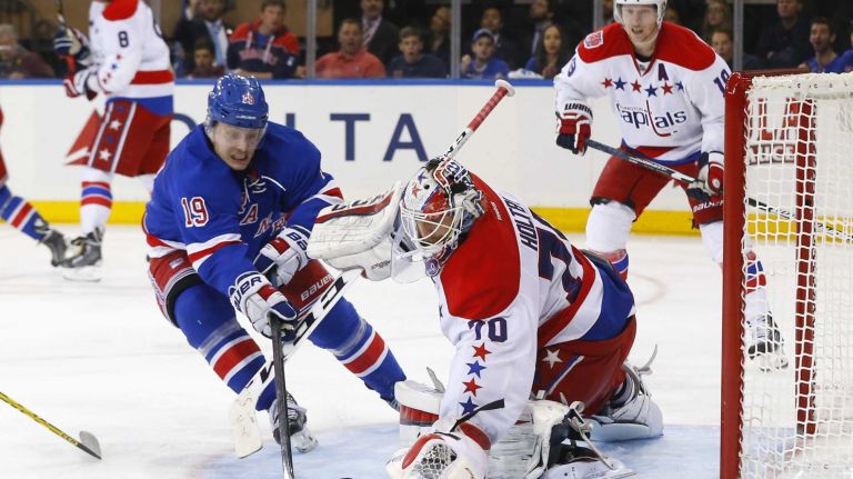 Rangers vs. Capitals: Game 2 of round 2 of Stanley Cup playoffs 30 Braden Holtby #70 of the Washington Capitals makes a third-period save against Jesper Fast #19 of the New York Rangers during Game 2 of the Eastern Conference semifinals at Madison Square Garden on Saturday, May 2, 2015.