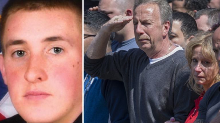 NYPD Officer Brian Moore, left. His father, at right, saluting, as family and friends watch an ambulance carry Moore's body from Jamaica Hospital Medical Center to the chief medical examiner's office in Manhattan on May 4, 2015.