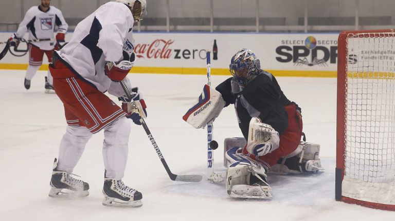 Henrik Lundqvist of the Rangers defends the net against Carl Hagelin on Thursday, May 28, 2015 at the MSG Training Center in Greenburgh, N.Y.