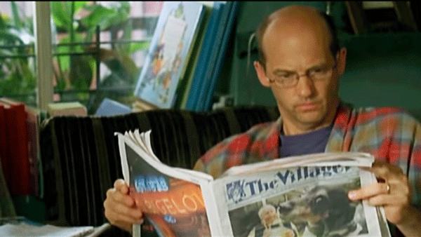 Anthony Edwards perused The Villager in “Motherhood” — not giving Uma Thurman his full attention!