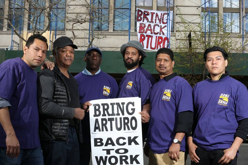 With fired doorman Arturo Vergara, far left, continuing from left, Printing House building staff, Kevin Samuel, Michael Suggs, Wendell Campbell, Omardath Rooplal and Jose Rios.   