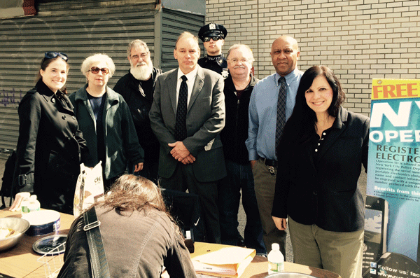 At the shredding event, from left, Nora Beyrent, Judith Callet and Jean-Luc Callet, all of BAMRA; Community Affairs Officer Martin Baranski and Auxiliary Officer Alexander Lois, of the Sixth Precinct; Ray Cline, of BAMRA; Crime Prevention Officer Robert Jackson of the Sixth Precinct, and event organizer Terri Cude.
