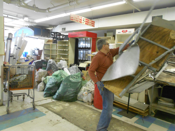 Glen Bruno, a co-owner of the Third Ave. Met Food market, recently cleared things out of the closed store.   Photo by Mary Reinholz