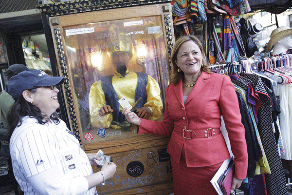 Rosie Mendez, left, and Melissa Mark-Viverito supported a local business — Zoltar! — during last Friday’s cash mob crawl along Second Ave.  Photo by William Alatriste / NYC Council