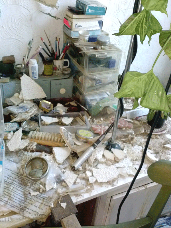 Hundred-year-old fallen plaster, paint and debris left in a tenant’s apartment, which was also water-damaged by firefighters who battled the massive blaze next door.   Photo by Yvonne Collery