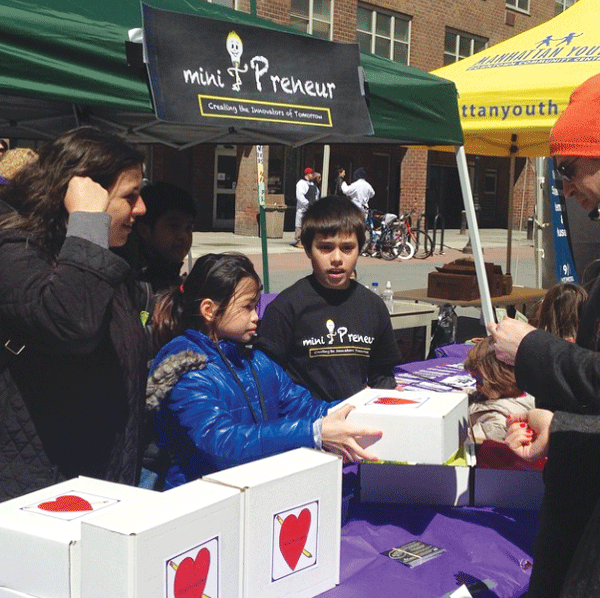 I.S. 276 sixth-graders managing their business, Hearts & Crafts, at the Tribeca Film Festival fair earlier last month.    Photo courtesy of Mini-preneur