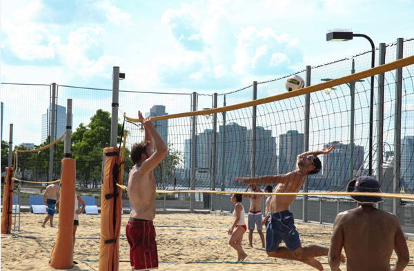 Hudson River Park Games athletes train to compete in beach volleyball on Pier 25.