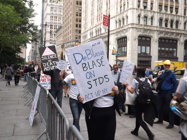 Chelsea Clinic Protests Shift Focus to Mayor 1 At a June 3 protest, demonstrators called out Mayor Bill de Blasio over the city’s widely panned handling of the Chelsea STD clinic closing. Courtesy Gay City News.