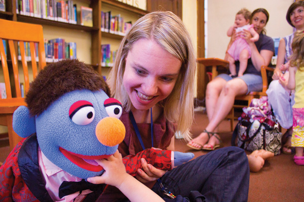 Downtown Express photos by Zach Williams Leroy entertained young children at the Hudson Library Branch with the help of children’s librarian Kristy Raffensberger.