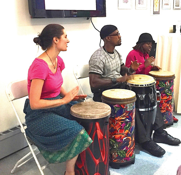 Although they didn’t have to drum up praise for VillageCare, a trio of percussionists provided the beat at the Empowerment Center’s opening.    Photo by Alicia Green