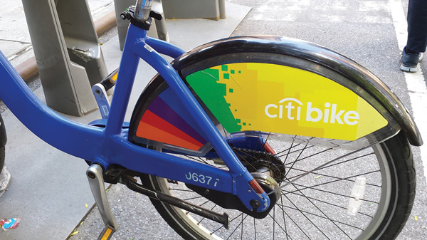Citi Bike users can ride with pride on rainbow-striped models recently rolled out for Gay Pride.   Photo by Scoopy