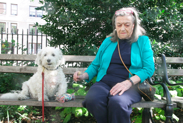 Cynthia Brennan and Pip enjoying sitting in the park.   PHOTO BY BONNY KAHANE