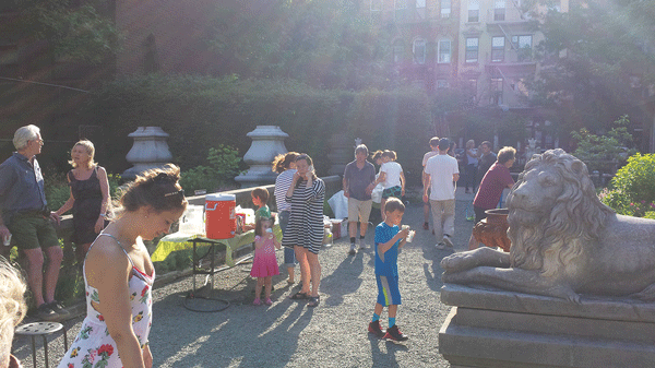 The Elizabeth St. Garden filled with activists and actively running kids enjoying the unique green space at an event celebrating the garden's volunteers last year.  Photo by Lincoln Anderson