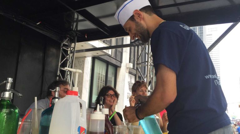 Alex Gomberg, one of the owners of Brooklyn Seltzer Boys, competes in an egg cream competition in Times Square on June 21, 2015. 
