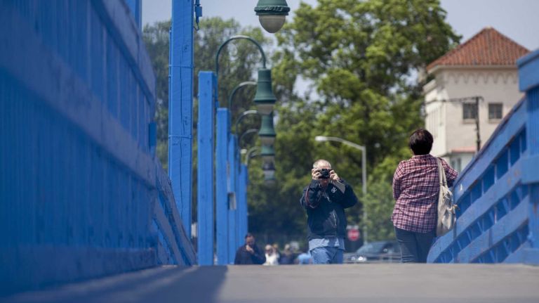 Visitors takes photos on Ocean Avenue Pedestrian Bridge near Shore Boulevard Manhattan Beach, New York on June 8, 2015. ?By Yeong-Ung Yang