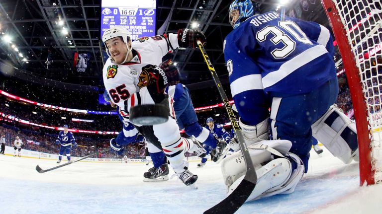 TAMPA, FL - JUNE 06: Andrew Shaw #65 of the Chicago Blackhawks scores a goal against Ben Bishop #30 of the Tampa Bay Lightning during the second period in Game Two of the 2015 NHL Stanley Cup Final at Amalie Arena on June 6, 2015 in Tampa, Florida. (Photo by Bruce Bennett/Getty Images)