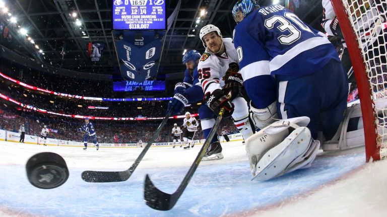 TAMPA, FL - JUNE 06: Andrew Shaw #65 of the Chicago Blackhawks scores a goal against Ben Bishop #30 of the Tampa Bay Lightning during the second period in Game Two of the 2015 NHL Stanley Cup Final at Amalie Arena on June 6, 2015 in Tampa, Florida. (Photo by Bruce Bennett/Getty Images)