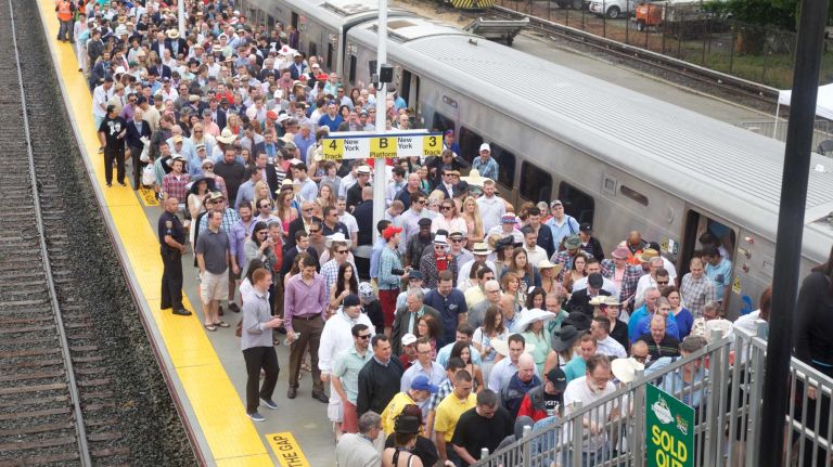 People arrive from the Long Island Rail Road before the 147th running of the Belmont Stakes at Belmont Park in Elmont on Saturday, June 6, 2015.