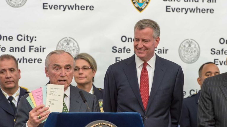 New York City Police Commissioner William J. Bratton, left, and New York City Mayor Bill de Blasio, right, hold a news conference at the YM & YWHA of Washington Heights and Inwood to unveil the NYPD's new neighborhood policing plan called 