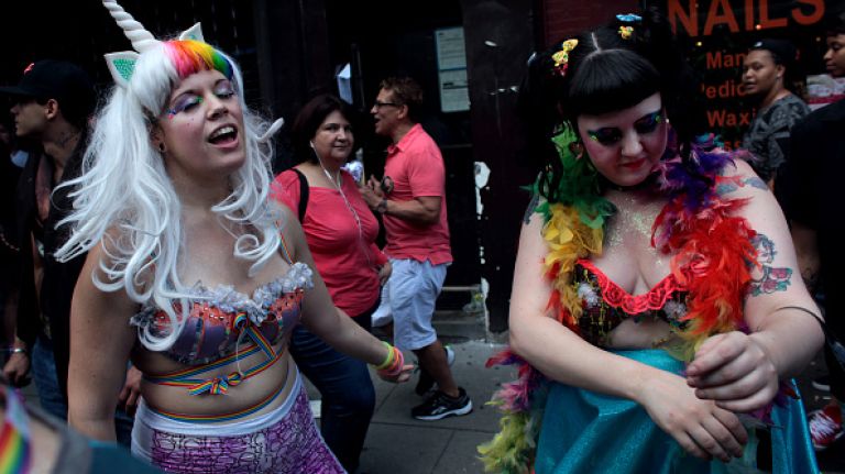 People dance during the Gay Pride Parade on June 28, 2015 in New York City.