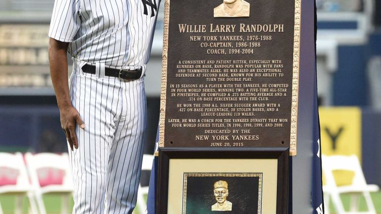 Former New York Yankee Willie Randolph stands with his Monument Park plaque during the 69th Old-Timers' Day at Yankee Stadium before a baseball game between the Yankees and the Detroit Tigers on Saturday, June 20, 2015.