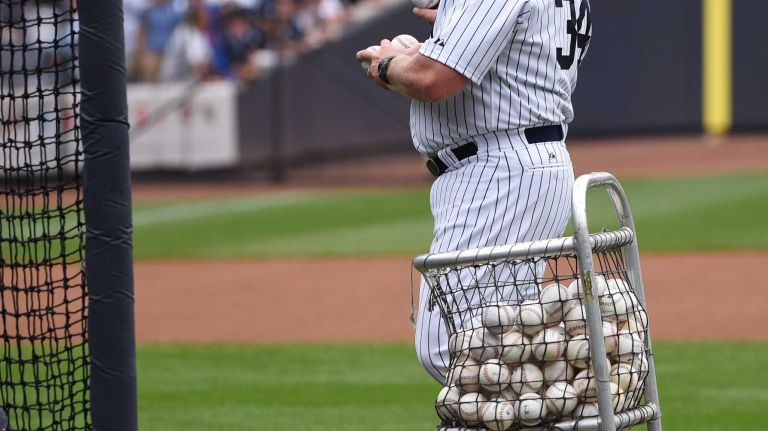 Former New York Yankees Scott Bradley pitches at batting practice during the 69th Old-Timers' Day at Yankee Stadium before a baseball game between the Yankees and the Detroit Tigers on Saturday, June 20, 2015.