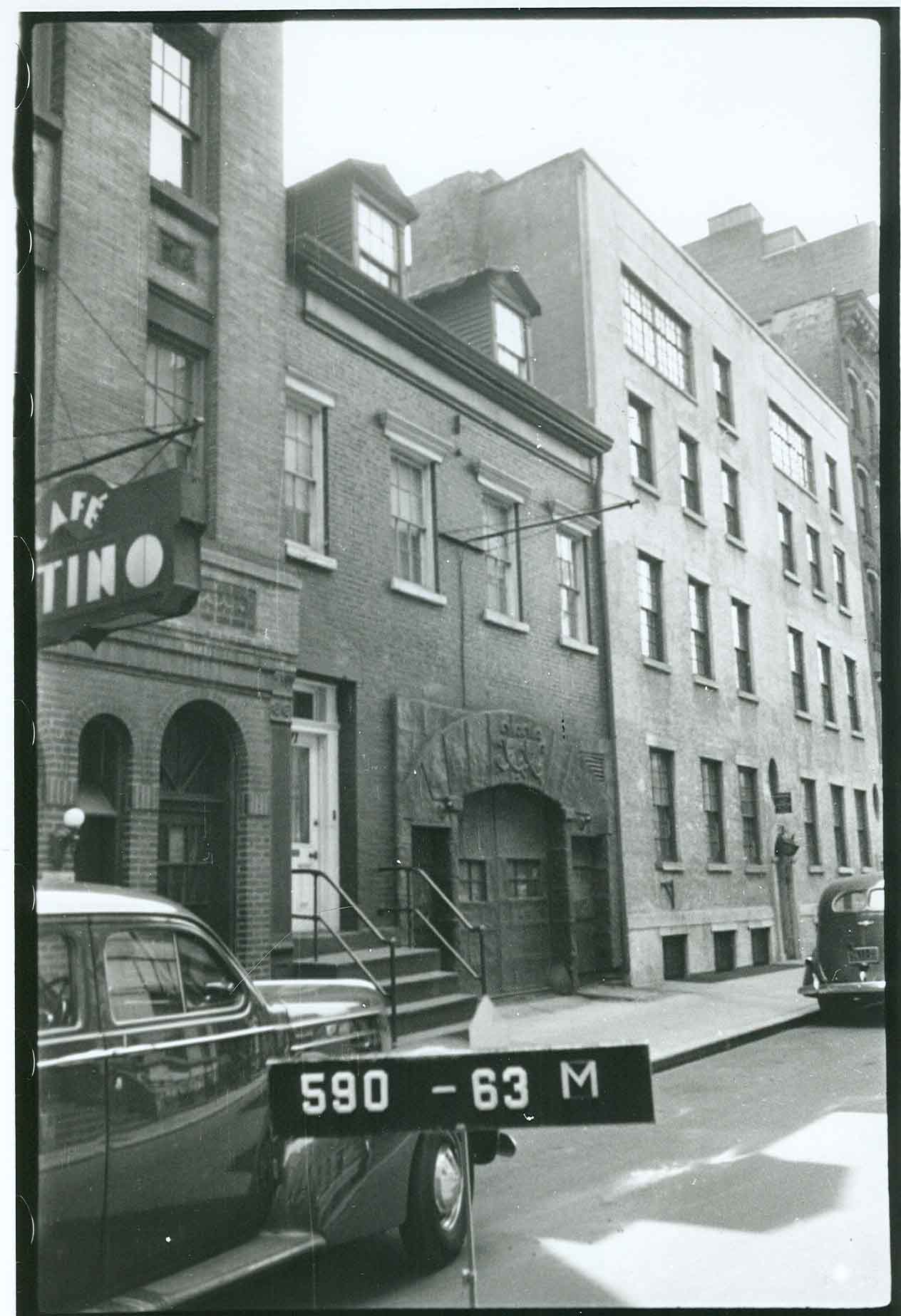 A 1940 tax photo of 17 Barrow St., provided by G.V.S.H.P.'s Andrew Berman, showing that the stucco arch above the doorway, in fact, was in place at that time. At some later point, it was painted white.