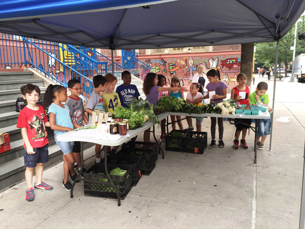 At PS11’s Farm Market, Third Graders In Business While School’s Out 2 Cloudy skies, sunny disposition: PS11’s third graders wait for customers to arrive on an overcast July 8. Photo by Alicia Green.