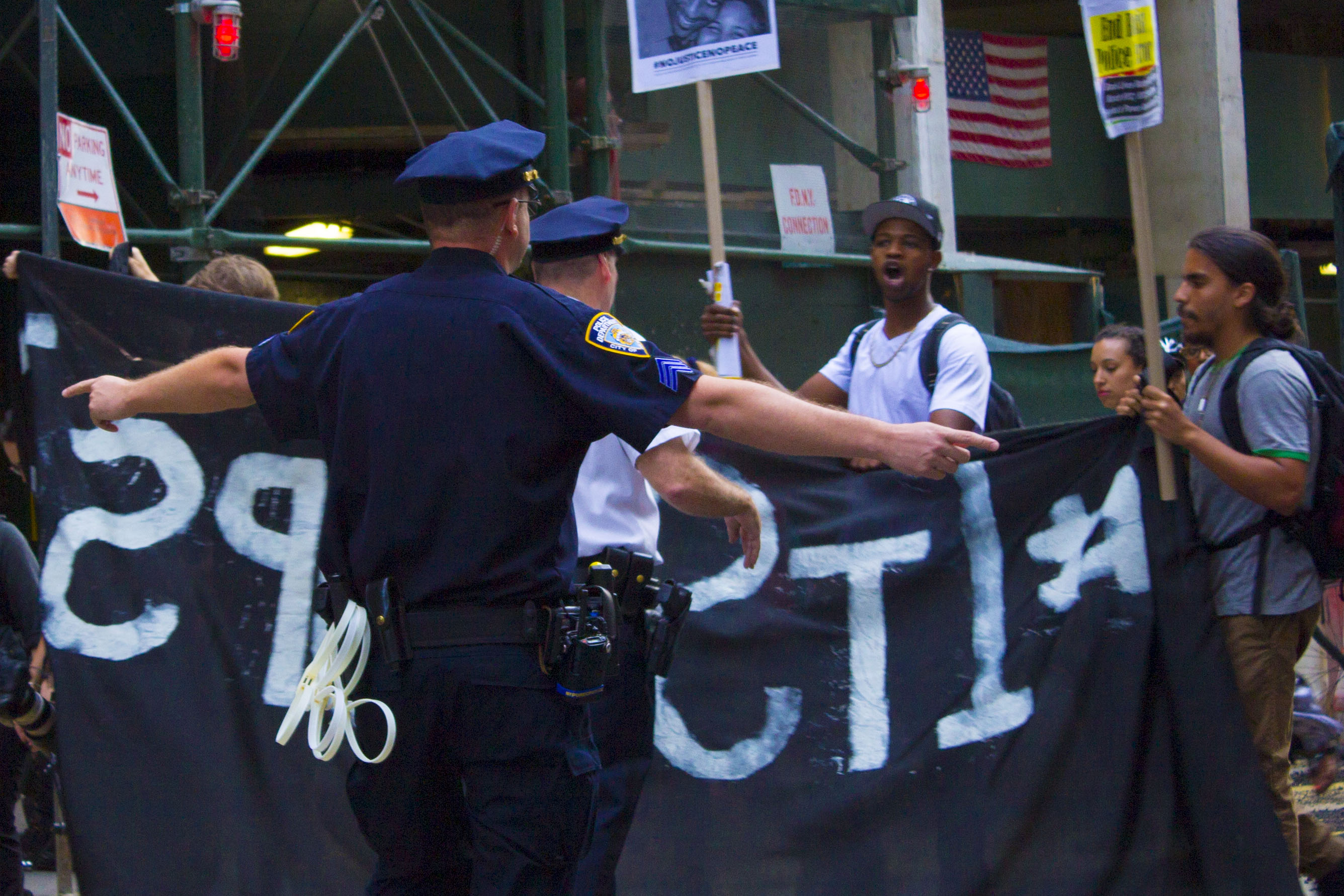 #BlackLivesMatter, One Year After Eric Garner 4 In recent months, NYPD officers have grown more assertive in confining protesters to city sidewalks. Photo by Zach Williams.
