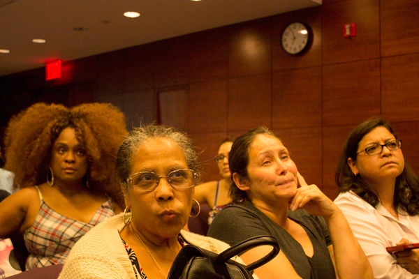 NYCHA residents, along with Councilmember Rosie Mendez, far right, listened to agency officials at the July 14 meeting.  Photo by Zach Williams