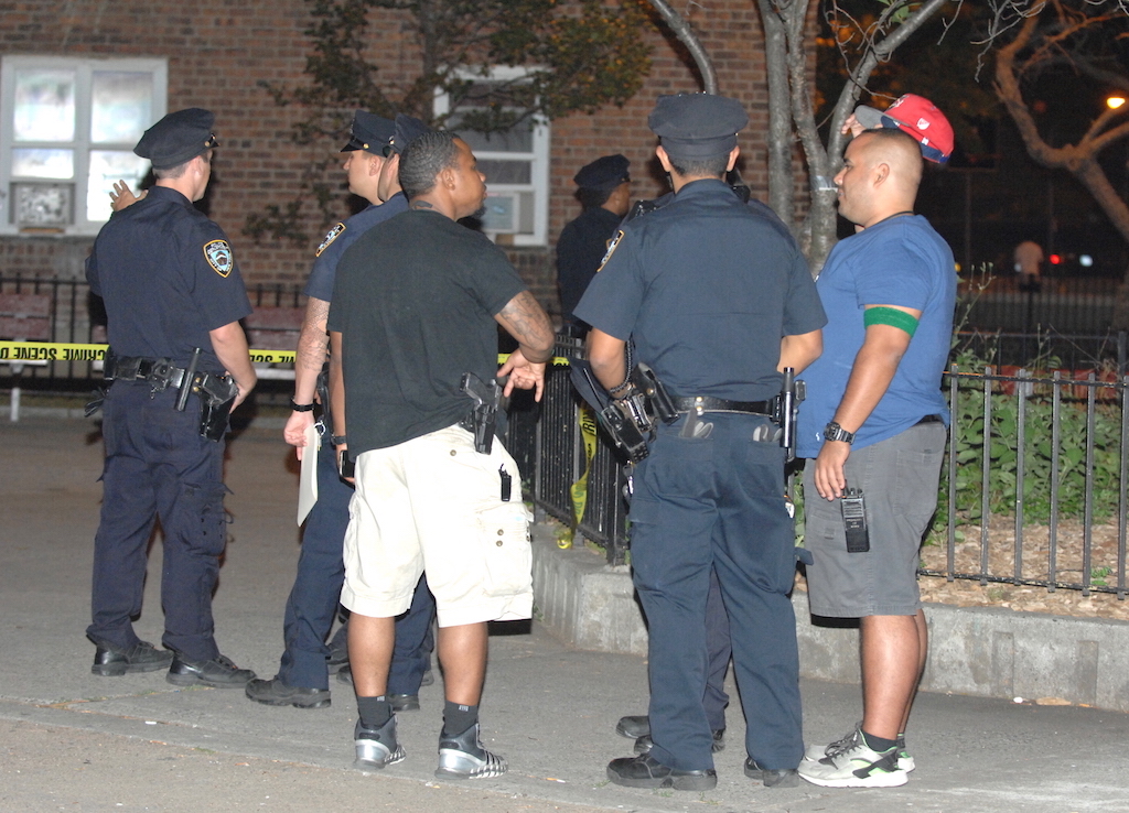 Police outside 178 Avenue D on Wednesday night after a shooting left one woman injured.