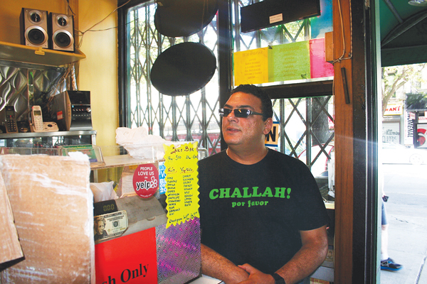 Owner Fawzy Abdelwahed inside B&H kosher dairy restaurant as repairs were being made this week.