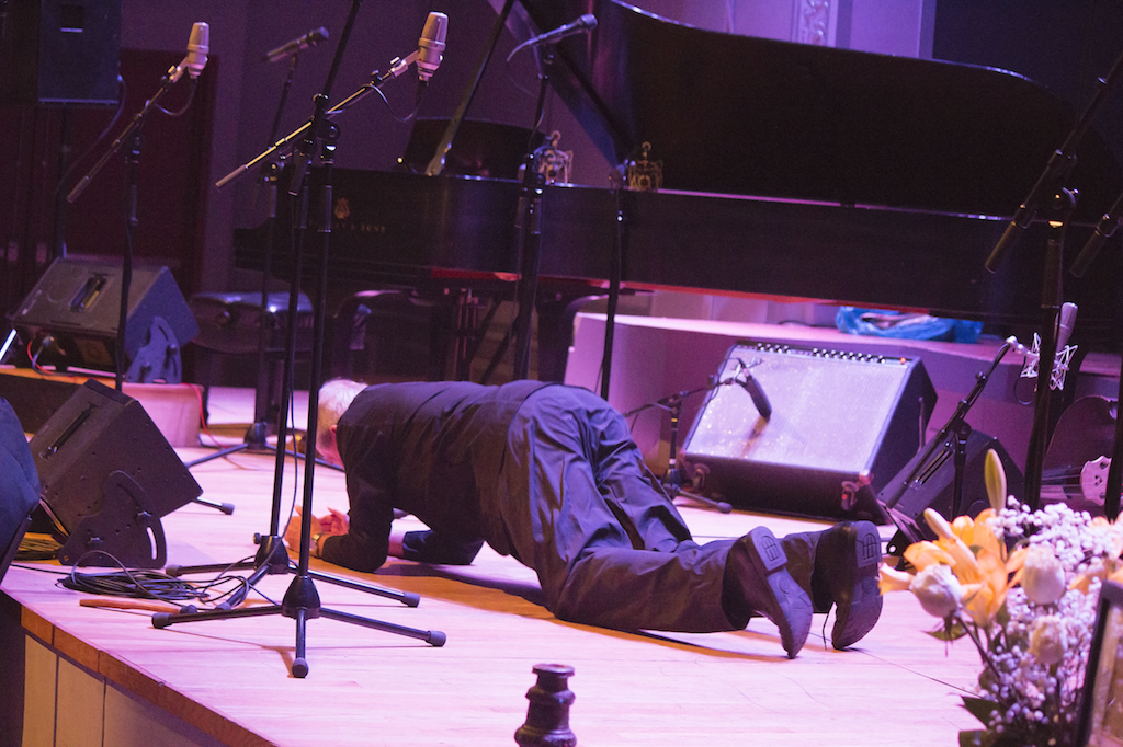 Baritone Thomas Buckner started singing unannounced from the crowd and sung into a corner for a while, before finally walking to the stage, where he went to the floor. The singing was more like interpretive noises. It was definitely appropriate for a memorial to experimental drummer Jerome Cooper. 