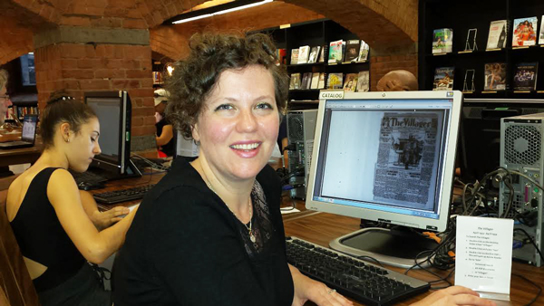 Corinne Neary at the computer terminal at the Jefferson Market Library where the newly digitized archives of early issues of The Villager can be read. Neary is overseeing the digitization effort.    Photo by lincoln anderson