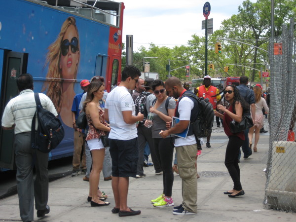 A ticket seller talking to tourists near the Battery. Downtown Express photo by Dusica Sue Malesevic