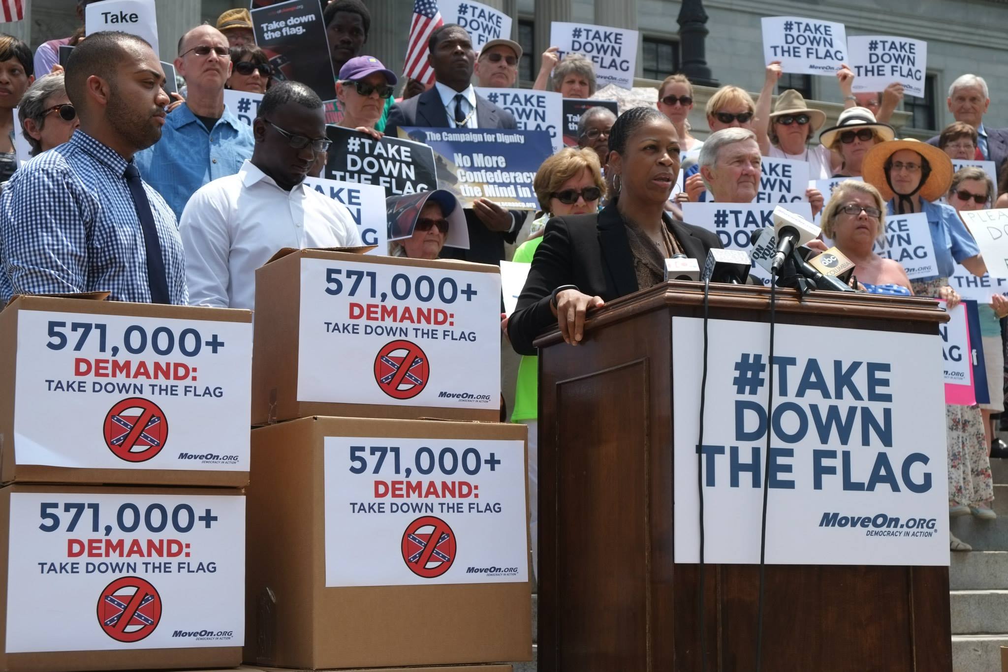 On Tuesday, MoveOn.org presented more than half a million petition signatures at the Columbia State House calling for removal of the Confederate flag in all government places. Speaking at the podium is MoveOn's Karen Hunter, who wrote the petition.