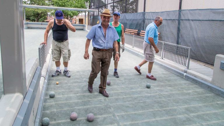 A group of men play bocce ball in Middle Village on July 12, 2015.