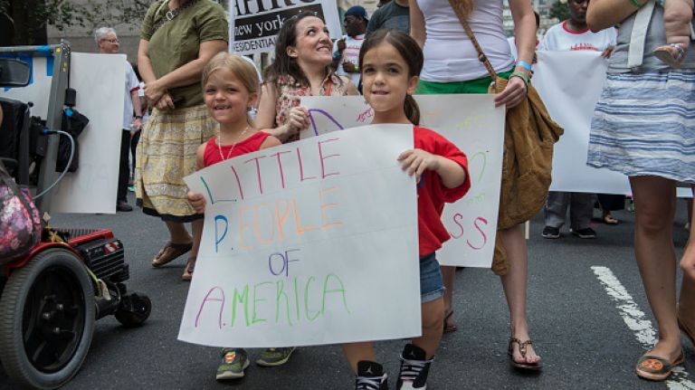 Scenes from the first annual Disability Pride parade in NYC 26 A group called the Little People of America participate in the first annual Disability Pride Parade on July 12, 2015 in New York City. The parade calls attention to the rights of people with disabilities and coincides with the 25th anniversary of the Americans with Disabilities Act.