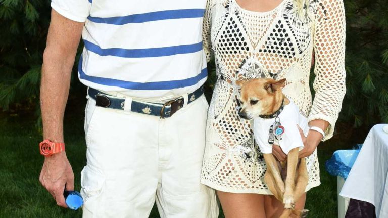 Harvey Katz, Ruth Katz and rescue dog Luigi at the Last Chance Animal Rescue benefit hosted by Ruth Katz on July 11, 2015, in Bridgehampton.